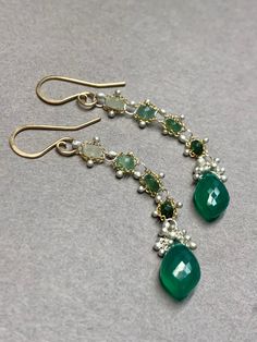 Woven faceted 3mm emeralds with faceted Green Onyx Marquise Briolettes are light weight and fluid.  Our woven earrings are handcrafted and thoughtfully designed to add movement and color that showcase these gemstones and you. *Rare stone setting by torching gems securely into place. *Unique metalwork of kinetic granulation resembling caviar (tiny silver balls torched into place) *Sturdy yet delicate *Rubber backs are included for you to keep them securely on your ears. Understated elegance.  The Elegant Green Briolette Gemstones, Elegant Green Briolette Jewelry, Elegant Faceted Emerald Gemstones, Emerald Multi-stone Jewelry For May Birthstone, Unique Faceted Green Jewelry, Unique Green Faceted Jewelry, Handmade Elegant Chrysoprase Earrings, Green Faceted Earrings For Anniversary, Chrysoprase Gemstone Drop Earrings