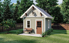 a small house with a bench in the yard