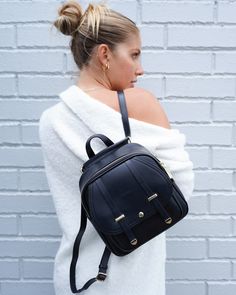 Beautiful and so practical! With our Camila Leather Backpack, you get two bags in one. This gorgeous style is made from top quality leather and is fitted with multiple internal and external pockets to store all your essentials and more. Gold-toned hardware gives it that extra sparkle. It converts from a backpack to shoulder bag just in seconds so you can rock any look with full confidence 24/7. Genuine leather construction  Backpack / Shoulder bag  Gold-toned hardware  Multiple internal and external pockets  Lining: vegan suede in blush pink Gorgeous Style, Stylish Handbags, Black Leather Backpack, Satchel Tote, Genuine Leather Handbag, Women Accessories Bags, Pearl Jewellery Earrings, Mens Jewelry Bracelet, Fine Jewelry Gift