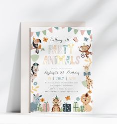 an animal themed birthday party is shown with the name and age on it's card