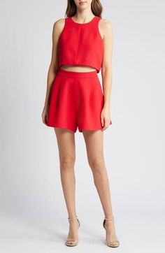 This two-piece romper made from pebbled crepe comes with a cropped tank and pleated high-waist shorts you can mix and match with other pieces in your wardrobe. 16" length; 3" inseam; 35" leg opening; 15" front rise; 17 1/2" back rise (size 8) Top has hidden back-zip closure; jewel neck; sleeveless Shorts have hidden back-zip closure Lined top 99% polyamide, 1% elastane Dry clean Made in the USA of imported fabric Women's Clothing Spring Crop Top For Night Out, Summer Party Crop Top, Chic Short Crop Top For Day Out, Spring Crop Top With Built-in High-waisted Shorts, Cropped Bottoms For Summer Night Out, Chic Fitted Cropped Shorts, Two-piece Cropped Bottoms For Summer, Summer Two-piece Cropped Bottoms, Summer Cropped Two-piece Bottoms