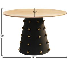 the height of a table with studded legs and an oval wooden top is shown