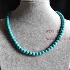 jewelry: man-made turquoise necklace colour: turquoise color Diameter: 8mm shape: round Necklace length: select Clasp: lobster Clasp, IF YOU LIKE IT WITHOUT A CLASP,PLEASE LET ME KNOW. Packing:Beautiful Pouch Click on the image(s) for larger view If you want to order of different style. Please feel free contact me . Thank you for your viewing. The other turquoise necklaces: https://www.etsy.com/shop/weddingpearl/search?search_query=turquoise+necklaces&order=date_desc&view_type=list&r Statement Necklace Wedding, Turquoise Necklaces, Genuine Pearl Necklace, Real Pearl Necklace, Pearl Necklace Wedding, Turquoise Bead Necklaces, White Pearl Necklace, Black Bead Necklace, Round Necklace