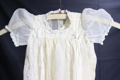 Vintage beautiful christening gown. It is in good condition, no tears. There is a even discoloring from age. Would be great for christening or to dress a baby in for a wedding. Vintage White Baptism Dress With Lace Trim, White Vintage Fitted Baptism Dress, Vintage Dress With Lace Trim For Baptism, Vintage Lace Trim Baptism Dress, Vintage Cream Dress For First Communion, Vintage Fitted Dress For First Communion, Vintage White Dress For Church, Vintage White Dresses For Church, Vintage White Church Dress