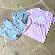 Nwt Adidas, 2-Piece Set, Shirt & Flare Pants, Size M 10/12 Colors: Pink & Gray Pink, Short Sleeve, Shirt Has “Adidas” Design On Front In White, Pink & Gray. Pants Are Gray, Elastic Waistband, Has Adidas Logo On Front In White. Content: Top: 56% Cotton | 44% Polyester Bottom: 95% Cotton | 5% Elastane Retail $19.97 Pink Casual Stretch Sets, Casual Stretch Pink Sets, Stretch Pink Cotton Sets, Pink Stretch Cotton Sets, Casual Pink Cotton Sets, Casual Stretch Sets For Playwear, Casual Pink Matching Set Bottoms, Casual Pink Bottoms Matching Set, Adidas Casual Tops For Playwear