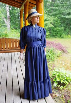 Classic Edwardian styled cotton very versatile 3-piece set! The blouse has shoulder to hem vertical pleating, 3/4 length full sleeves gathered to a cuff, button back, and center front split turn back collar. The skirt has a wide flounce with an elastic waist. The waist is wrapped with a matching cotton belt. Designed and made by Recollections in America. 100% cotton. Hand or machine wash cold gently; hang or tumble dry low. Leisa is wearing a brooch, hat, gloves, and boots and they are priced se Classic Fitted Long Sleeve Prairie Dress, Cotton Victorian Dress For Formal Occasions, Regency Style Long Sleeve Prairie Dress For Fall, Cotton Victorian Long Sleeve Dress For Fall, Long Sleeve Cotton Victorian Dress For Fall, Fall Victorian Long Sleeve Cotton Dress, Elegant Prairie Dress For Fall Daywear, Peasant Style Victorian Dress For Daywear, Long Sleeve Victorian Dress For Daywear