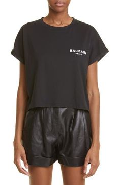 The Balmain Paris logo pops in contrast-color flocking at the chest of this roomy cropped T-shirt framed by cuffed short sleeves. 20" length (size X-Large) Crewneck Short sleeves 100% cotton Machine wash, dry flat Made in Portugal Women's Designer Clothing Black Logo Tops For Spring, Cropped Shirt Outfit, T Shirt Frame, Diamond Texture, Paris Shirt, Paris Logo, Paris T Shirt, Balmain Paris, Crop T Shirt