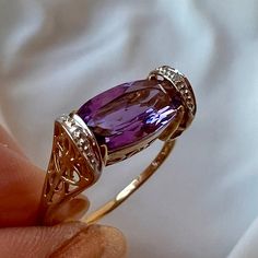 Gorgeous Vintage Ring In Solid 10k Yellow Gold (Stamped And Tested) , With Beautiful Genuine Amethyst Stone And Tiny Tiny Diamond Chips That Add Some Sparkle When Hand Is Moved. The Main Stone Is Approx. 10mm Long By 6mm Wide . The Ring Is A Tiny Bit Shy Of A Size 7.75 On Ring Mandrel, Weights 2.4 Grams. Really Well Made, Versatile Piece Of Jewelry That Totally Looks Like A Designer Made Piece!!!! Amethyst Vintage Ring, Amethyst And Diamond Engagement Ring, Engagement Wishes, Ring Mandrel, Purple Amethyst Ring, Amethyst And Diamond Ring, Tiny Diamond, Vintage Ring, Amethyst Stone