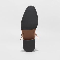 From formal meetings and events to family functions, these Leo Oxford Dress Shoes from Goodfellow & Co™ are a great pick to complete your ensemble. These medium-width shoes feature a cushioned footbed for comfy wear, making them great for both special occasion and everyday wear. With a sleek upper with stitched detailing and a lace-up front, they're perfect for creating a sharp, stylish look. Goodfellow & Co™: Where style & fit are always in good company. Classic Formal Lace-up Shoes With Ortholite Insole, Business Wingtip Dress Shoes With Ortholite Insole, Formal Synthetic Dress Shoes With Pointed Toe, Formal Synthetic Leather Shoes With Almond Toe, Brown Formal Oxfords With Ortholite Insole, Formal Synthetic Oxfords With Pointed Toe, Formal Synthetic Oxfords With Leather Sole, Classic Formal Synthetic Boots, Formal Synthetic Wingtip Dress Shoes