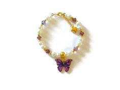 "A adorable little butterfly bracelet for the butterfly lover. This item is made of glass pearls with amethyst bicones, a beautiful butterfly charm all strung on wire and closes with a lobster clasp. There is a one inch growth chain with a small heart attached to the end of the bracelet. This item comes with a gift card and enclosed in a organza gift bag. If this item is for a flower girl you can choose a poem/quote from the following link: https://www.etsy.com/listing/259149538/20-sample-flower Bracelet Butterfly, Flower Girl Bracelets, Little Butterfly, Bracelet Pearl, Butterfly Bracelet, Flower Girl Gifts, Great Birthday Gifts, A Poem, Purple Butterfly