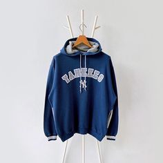 90s New York Yankees MLB hoodie/ XL * PLEASE READ BEFORE PURCHASE * PLEASE consider the PHOTOS before making the decision * The images may DIFFER in appearance from the actual product because we took pictures under daylight.  * PLEASE send your PHONE NUMBER after your purchase for the shipping company to contact you X No returns X No refund Condition : 9/10 More details : look at the pictures  Brand : Lee Size : XL Pit to pit/ Chests : 25/50 inches  Length : 28.5 inches  Material : cotton polyester  Color : blue  * ALL ITEMS are VINTAGE which may show some signs of wear and tear * Due to the different display and different light, the picture may not reflect the actual color of the item * Please, remember that our items are vintage so they may show some signs of wear, tear and yellow stains Hip Hop Hooded Sweatshirt For College, Oversized 90s Hoodie For Winter, Oversized 90s Winter Hoodie, Varsity Hoodie For Streetwear, Varsity Hooded Jacket For Streetwear, Varsity Hooded Hoodie For Winter, 90s Style Streetwear Sweatshirt With Drawstring Hood, Winter Varsity Hooded Hoodie, 90s Hooded Sweatshirt For Streetwear