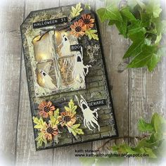 an altered book with halloween decorations on it