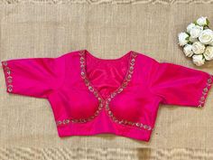 Shop fuschia pink embroidered designer sari blouse online in USA. Elevate your saree style with exquisite readymade saree blouses, embroidered saree blouses, Banarasi sari blouse, designer saree blouse, choli-cut blouses, corset blouses from Pure Elegance Indian fashion store in USA.-front Pink V-neck Blouse Piece For Wedding, Pink Zari Work Top For Reception, Embroidered Semi-stitched V-neck Blouse, Embroidered V-neck Semi-stitched Blouse, Pink Embroidered Top For Reception, Traditional Pink Tops For Reception, Pink Tops For Diwali Reception, Pink Top For Diwali Reception, Pink Tops For Reception During Diwali