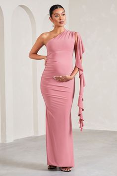 Add some flair to your maternity wardrobe this party season with our blush pink maxi Rosalie. Crafted in our signature stretch jersey. this dress is defined by a delicate ruffle detail that drapes effortlessly down your side. Finishing with an elegant fishtail skirt. try styling Rosalie with gold earrings and a sleek bun for the perfect wedding guest ensemble. Features - Premium stretch jersey- Asymmetric neckline- Draped ruffle detail- Sleeveless - Invisible zip closure - Fishtail skirt- Maxi length Sizing & Fit Model is 5'8.5" and wears UK size 8 / US size 4 Product Information Designed exclusively by Club L London Double layered with excellent stretch Premium jersey in Blush Pink (95% Polyester. 5% Elastane) 153cm total length SKU: CL129579081 Elegant Pink Maxi Maternity Dress, Elegant Pink Maxi Length Maternity Dress, Pink One-shoulder Stretch Maxi Dress, Pink Off-shoulder Ruched Maxi Dress, Pink Ruched Off-shoulder Maxi Dress, Pink Stretch One-shoulder Maxi Dress, Pink Maxi Length Maternity Dress, Fitted Pink Maxi Maternity Dress, Pink Stretch Maxi Dress For Prom