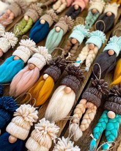 many different colored hair dolls are on display for sale at a market stall in the city