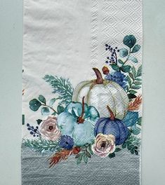 a white towel with flowers and pumpkins on it