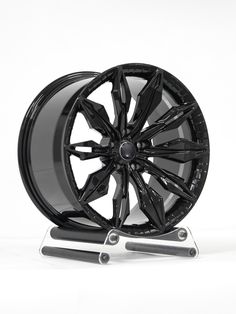 a black wheel is shown on a stand