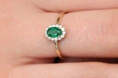 "Emerald Ring / 14k Classic Oval Cut Emerald Ring with Surrounding Diamonds / Natural Emerald Ring in 14k Solid Gold / Mothers Day Gift * If you would like to see the Matching Earrings Please Click Below https://www.etsy.com/listing/604292239/emerald-earrings-14k-oval-cut-emerald?ref=related-4 * If you would like to see the Matching Necklace Please click Below https://www.etsy.com/listing/590436480/emerald-necklace-14k-classic-oval-cut?ref=related-1 Item Features * Made to Order. * Gold KT: 14K