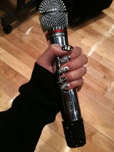 a person holding a microphone in their hand