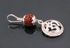 Awesome handmade indian jewelery, sterling silver with natural rudraksha beads pendnat , gorgeous jewelry from rajasthan india.Metal-Sterling silverBrand-traditional-jewellery.Length-50 inchesWidth-19 mm approx.Weight-4.00 grams.Stone- Natural Rudrakshamakes excellent gifting and collectible pieces Silver Amulet Jewelry For Diwali, Sterling Silver Temple Jewelry For Meditation, Sterling Silver Beads Jewelry For Meditation, Silver Filigree Jewelry For Diwali, Silver Spiritual Earrings For Rituals, Jai Mahadev, Pendent Design, Shivaji Maharaj Painting, Rudraksha Jewelry