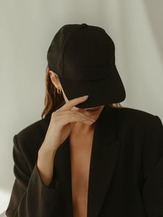 Our classic black on black six panel ball cap. Make a blazer casual cool, or active wear streetwear ready. Features a curved brim with adjustable strap and a black embroidered logo and label on the back. This item is a final sale.FORWARD BASICS10% of all sales benefit female forward charities giving back to women through the provision of resources and opportunities. DETAILS* Black Ball Cap with Black logo and label * One size, adjustable closure * Structured, 6-panel * Unisex FABRIC + CARESpot c Girls Wearing Caps, Cap For Girls Style, Black Cap Outfit, Ball Cap Outfit, Sporty Cap, Streetwear Photoshoot, Driving Cap, Plain Caps, Cap Outfit