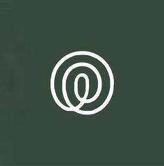 the letter q is made up of white lines on a dark green background with an oval shape