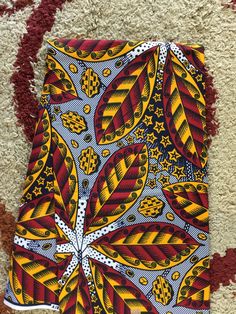 This red African Fabric is high quality African print made from 100% cotton and it's 45 inches wide. It is used for making African Clothing, African quilts, & For Home decoration. FYI: Print is Double sided. The listing is for 1, 6 yards and Headwrap Each piece of fabric measures: 36in by 45in for 1 yard 216in by 45in for 6 yards 70in by 22in for Head wrap If you purchase more than one yard, you will receive one continuous piece. *If you require more than what I have listed, feel free to sen Traditional Patterned And Printed Fabric, Traditional Patterned Fabric And Notions, Unique Fabric Patterns, Ankara Fabric Patterns, Multicolor Print Fabric, Traditional Patterned Fabric For Festivals, Multicolor Printed Digital Prints For Festivals, Traditional Printed Multicolor Fabric, Traditional Multicolor Printed Art