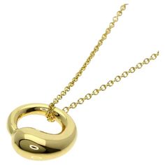 TIFFANY & Co. Elsa Peretti 18K Gold 12mm Eternal Circle Pendant Necklace Metal: 18K yellow gold Chain: 16" Pendant: 12mm in diameter Weight: 5.30 grams Hallmark: "TIFFANY&Co. ©Elsa Peretti 750 SPAIN" on pendant, "TIFFANY&CO. 750 PERETTI SPAIN" on chain tags Limited edition, no longer available for sale in Tiffany stores. It retailed for $1,700 in Tiffany stores. Tiffany price has been going up. The current estimated retail value is $1,900 to $2,100. Authenticity Guaranteed Tiffany Setting, 100 Dollars, Tiffany Diamond, Star Of David Pendant, Aquamarine Necklace, Round Pendant Necklace, Elsa Peretti, Circle Pendant Necklace, Modern Necklaces