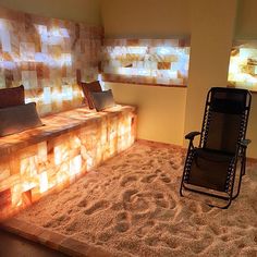 a chair sitting on top of a carpet covered floor next to a wall with windows