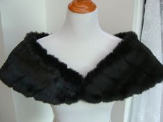 "I made this shoulder shrug out of black mink faux fur and lined the wrap with black fleece for warmth and comfort. The shawl is 43\" long on the upper cut, cut on a curve for a better fit, and 8\" wide(long) at the back. You can pin in place or add your own special piece of pinned jewelry for a perfect fit. Spot clean or dry clean. Optional hook and eye closure available." Fur Stole Wedding, Black And White Makeup, Faux Fur Shrug, Fur Shrug, Faux Fur Shawl, Black Shrug, Faux Fur Stole, Fur Wrap, Shoulder Wrap