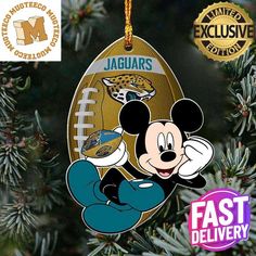 a mickey mouse ornament hanging from a christmas tree with the jacksonville football team on it