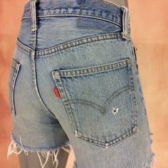 Rare! 1970's Authentic selvedge redline Levi's, button stamp #6 Brand: LEVIS 501  Fits like 27" waist, 11.25" rise, 22 thighs, 38.5" hips, 3" inseam,! Fits a size 27, but check your measurements and compares the measurement with your garment. (see full measurement below) Recommended waist size: 27" Material :  Cotton 100% Button #6 Selvedge Jeans Made In USA NOT YOUR SIZE? LOOK OTHER LISTING ✂-- www.etsy.com/shop/AberyApparelClothing Distressed Thrashed Cutoff Short Light Wash Selvedge Jeans Tru Retro Straight Leg Jean Shorts With Pockets, Retro Straight Leg Shorts With Pockets, Vintage Cutoff Jean Shorts With Belt Loops, Vintage Mid-rise Shorts With Pockets, Retro Medium Wash Bottoms With Standard Cut Leg, Vintage Medium Wash Cutoff Bottoms, Vintage Distressed Cutoff Bottoms, Retro Cutoff Jean Shorts With Pockets, High Waist Distressed Retro Bottoms