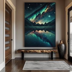 a large painting hanging on the wall next to a wooden bench in a living room