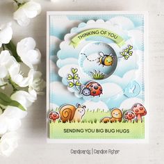 a card with some flowers on it and the words sending you big hugs written in white