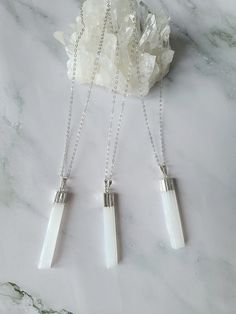 Pure and elegant selenite crystal necklace.  This cleansing pendant comes on a sterling silver cable chain that is available in 3 lengths. Wear this natural selenite pendant on its own or pair it up for that gorgeous layering look. The selenite crystal is not only beautiful but a translucent crystal that evokes energies of healing and protection. Selenite is a cleansing crystal that purifies, clears, and gives off positive energy. The soft white appearance of the stone is a perfect reflection of its gentle but highly effective energy, which emits white light and high vibrations. Free shipping within Canada is not tracked. If you would like tracked shipping, you can select at checkout for an additional amount. White Minimalist Round Pendant Crystal Necklace, Minimalist White Round Pendant Crystal Necklace, White Sterling Silver Pendant Crystal Necklace, White Sterling Silver Crystal Pendant Necklace, White Sterling Silver Crystal Necklace With Round Pendant, White Moonstone Pendant Crystal Necklace, Minimalist White Sterling Silver Crystal Necklace, Sterling Silver White Crystal Necklace Gift, White Sterling Silver Crystal Necklace As Gift