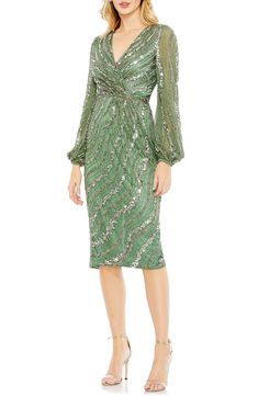 Swirls of sequins animate this elegant cocktail dress, rendered in a verdant hue and styled with a gracefully draped bodice. Surplice V-neck Long sleeves Lined, except sleeves 100% polyester Spot clean Imported Asian Owned/Founded Mesh Cocktail Dress, Vestidos Color Coral, Cocktail Dresses With Sleeves, Dress Sparkle, Tea Length Skirt, Intricate Beading, Elegant Cocktail Dress, Radiate Confidence, Unique Prom Dresses