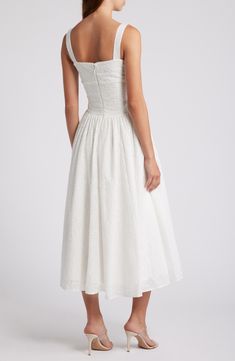 Eyelet and ribbon lacing adds an edgy touch to a vintage-inspired sundress boasting a bustier-style bodice and flared midi skirt. Exclusive retailer Square neck Side patch pockets Lined 77% viscose, 21% polyester, 2% elastane Dry clean Imported Elopement Dresses, Flared Midi Skirt, Halter Sundress, Elopement Dress, Midi Flare Skirt, Midi Sundress, Floral Sundress, Lace Corset, House Of Cb