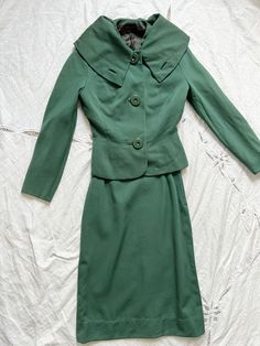 vintage 1940s green tweed two piece jacket skirt suit set  size small Fabric is a green wool Lovely collar and round green buttons Brand label Rumonte Continental Wool fabric  good condition except for a tiny hole in the fabric in the back of the jacket see photos Jacket is fully lined Skirt is not lined Skirt has a zipper closure at the back Measurements Jacket Sleeves 23 Chest 17 Length 20.50 Shoulder 16 Skirt Length 25 Waist 11 Hips 17 Measurements are taken flat Measurements: please allow a Tweed Two Piece, Green Tweed, Skirt Crop, Skirt Suit Set, Green Button, Green Suit, Green Wool, Vintage Coat, Skirt Suit