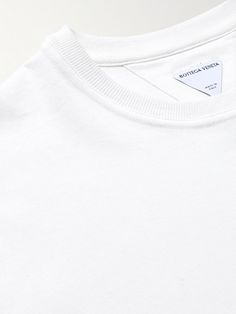 Bottega Veneta makes even wardrobe staples feel considered. This 'Sunrise' T-shirt is made from cotton-jersey and finished with logo-embroidered cuffs and a signature triangle at the nape. Embroidered Cuffs, New Bottega, White Shirt Men, A Signature, Latest T Shirt, Plain Tshirt, White Shirts, T Shirt For Men, Mr Porter