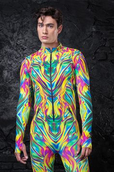 Conquer the rave scene in our Melting Reality Costume.   Features: Mock Neckline Robust & Front Zipper Closure Long Sleeves UV Black Light Reactive 82% Polyester 18% Elastane Non-Transparent Italian Lycra 30° Cold Wash, Hang dry Fitted Long Sleeve Rave Top, Multicolor Fitted Tops For Pride, Fitted Multicolor Tops For Pride, Fitted Multicolor Tops For Club, Skeleton Bodysuit, Rave Scene, Perfect Halloween Costume, Costume For Men, Rave Costumes