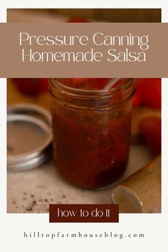 a jar filled with homemade canning sauce sitting on top of a table