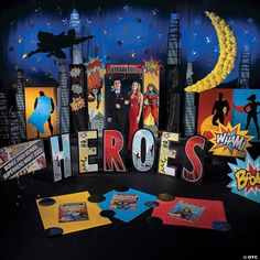 there is a man and woman standing in front of the word hero's surrounded by comic books