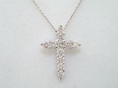 "HERE IS BEAUTIFUL HAND MADE CROSS PENDANT NECKLACE 18 KARAT WHITE GOLD AVAILABLE YELLOW OR ROSE GOLD TOO ASK ME PLEASE COMES WITH 16\" OR 18\" INCH CHAIN 11 DIAMONDS SI1 G COLOR TOTAL 0.65 CARAT VERY FINE & FULL PRONG SET !! VERY CLEAN AND BRIGHT WHITE COLOR DIAMONDS RETAIL PRICE IS OVER $2700.00 COMES WITH $1900.00 APPRAISAL !! DREAM IT I\"LL MAKE IT SPECIAL ORDER WELCOME PLEASE VISIT MY ONLINE STORE JEWELRYBYGARO.ETSY.COM HANDCRAFTED IN THE USA TEL: (212) 398-7002 CELL: (201) 315-5997 Why Classic White Diamond Necklace Hallmarked, Classic White Hallmarked Diamond Necklace, Diamond White Cross Pendant Necklace For Formal Events, Formal White Diamond Necklace Hallmarked, Formal White Hallmarked Diamond Necklace, White Cross Pendant With Single Cut Diamonds, White Hallmarked Diamond Necklace For Formal Occasions, Formal Classic Cross Necklace, White Gold Formal Diamond Cross Pendant Necklace