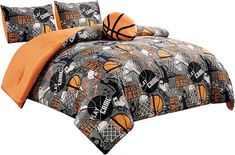 a bed with basketballs on it and two pillows in front of the comforter