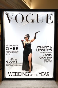 a woman in a black dress on the cover of a magazine