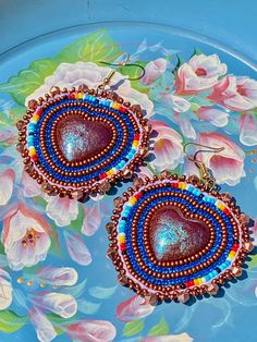 Beautiful hand beaded earrings made of high quality beads. A truly stunning pair of earrings!  Fishhooks are 18kt gold.