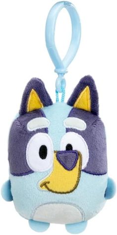 a stuffed animal keychain with a cartoon character on it's face and eyes