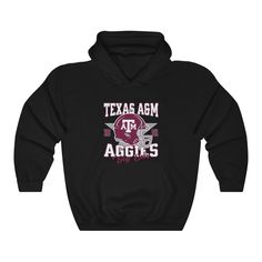 Gear up for game day with the Black Texas A&M Aggies Football Hoodie Sweatshirt. This cozy and stylish hoodie is perfect for chilly evenings at Kyle Field or showing your team pride around town. Featuring a bold Aggies Football graphic on a sleek black background, this hoodie is a must-have for any Texas A&M fan. Stay warm and comfortable while representing your favorite team in this essential piece of Aggie gear. Game Day Long Sleeve Fan Apparel Hoodie, Game Day Fan Apparel Hoodie With Long Sleeves, Varsity Fan Gear Hoodie Top, Varsity Hoodie Fan Gear Top, Fall Varsity Sweatshirt With Team Logo, Team Logo Sweatshirt For Sports Events In Fall, Sports Fan Long Sleeve Hoodie For Sports Season, Team Logo Hoodie Long Sleeve Fan Gear, Team Logo Hoodie For Fan Gear