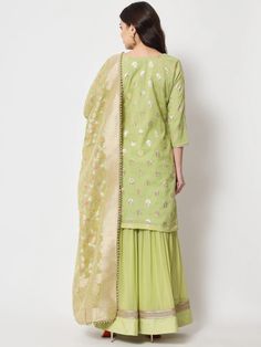 This is a beautiful 3-piece suit set. It comes with straight cut kurta with foil print detailing has 3/4th sleeves, v neck & short length teamed with flared sharara pants and a georgette banarasi dupatta. 3-piece set Color- Pista Green Work- Foil Print Detailing Kurti Length - 36 inch Kurta Fabric-Chanderi Bottom Fabric -Chinon Dupatta Fabric - Georgette Banarasi Dupatta. Sleeves-3/4th Sleeves Neck-V Neck Care - Dry Clean Flared Sharara, Sharara Pants, Pista Green, Dupatta Set, 3 Piece Suits, Suit Set, Foil Print, Indian Wear, Straight Cut