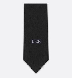 The tie is distinguished by the tonal Dior Oblique jacquard, first presented among the House's creations in 1969. Crafted in black silk, the tie will elegantly embellish any suit.. Luxury Business Suit And Tie Accessories, Luxury Ties For Workwear, Luxury Standard Tie For Work, Luxury Standard Tie For Formal Occasions, Luxury Black Suit And Tie Accessories For Business, Elegant Black Suit And Tie Accessories For Evening, Luxury Silk Ties, Luxury Tailored Ties For Semi-formal Occasions, Designer Semi-formal Suit And Tie Accessories